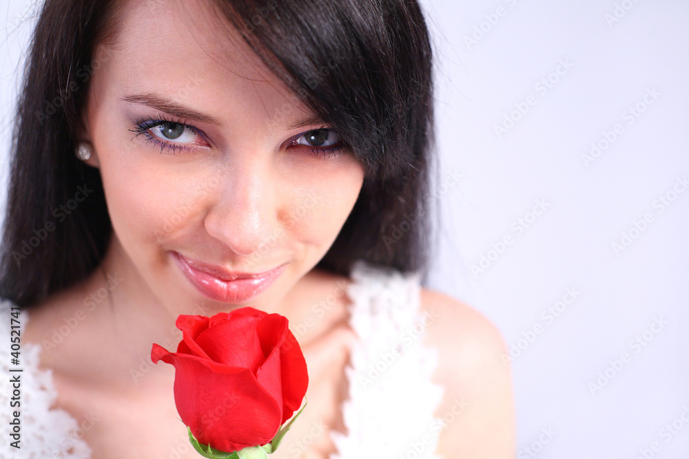 Young woman holding a rose Young woman holding a rose