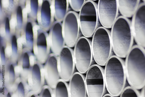 Close up of a stack of steel pipes photo