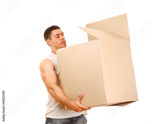 A young guy carrying a box