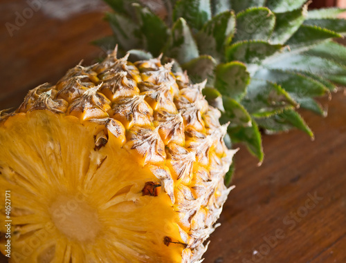 Pineapple fruit, half cutting on the table