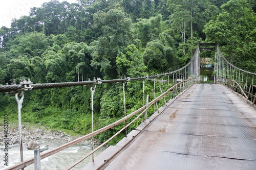 Fototapeta Naklejka Na Ścianę i Meble -  Suspension bridge on a border to Sikkim, India
