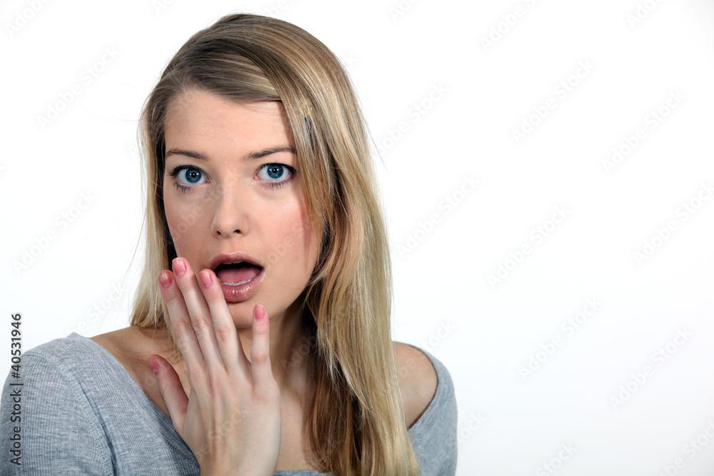 blonde looking surprised with fingers before mouth blonde looking surprised with fingers before mouth