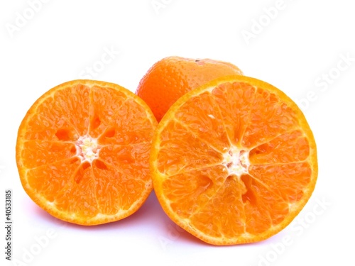 sliced and whole orange isolated on white background