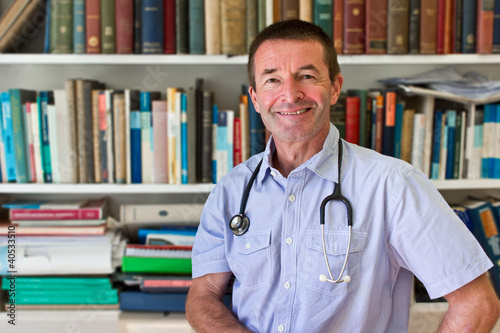 White Doctor In Front Of Books