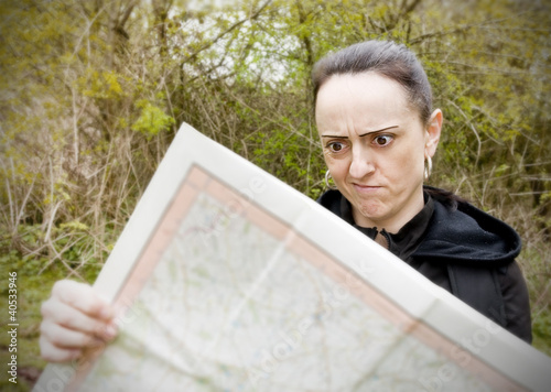 woman confused looking at map