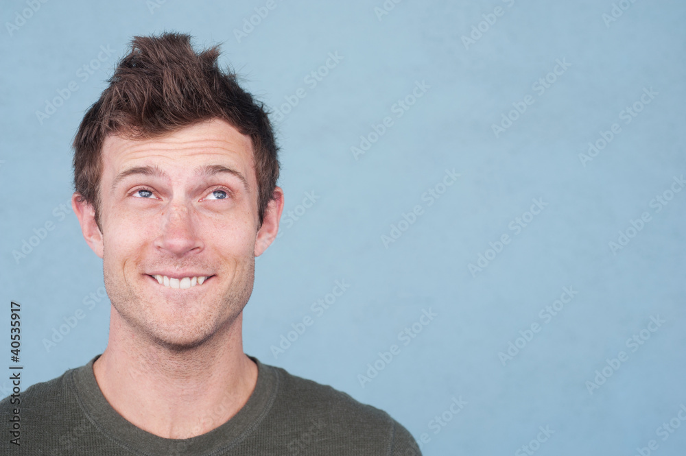 Fototapeta premium portrait of a handsome young man looking up