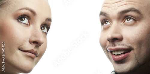 Closeup portrait of happy man and woman looking up