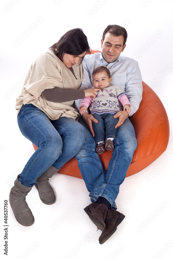Happy family of parents and daughter in causal clothes Happy family of parents and daughter in causal clothes