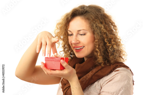 Beautiful surprised woman holding gift with ribbon
