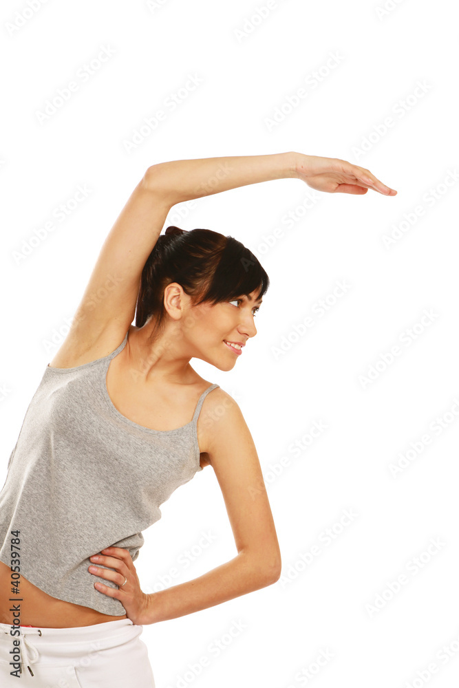 A young woman doing exercises , isolated on white background A young woman doing exercises , isolated on white background