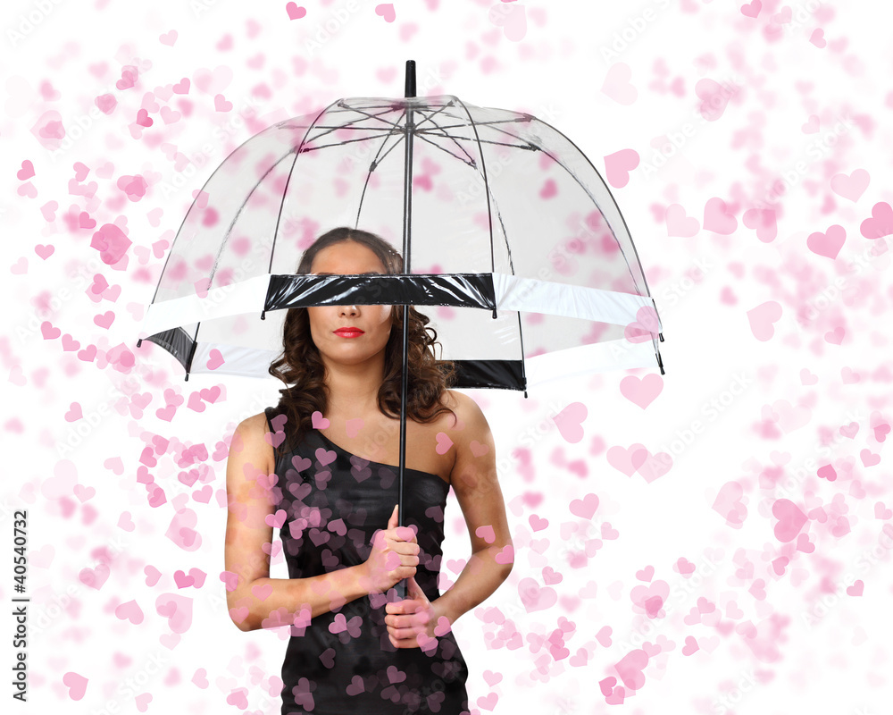 Fototapeta premium Pretty woman under umbrella with petals around her
