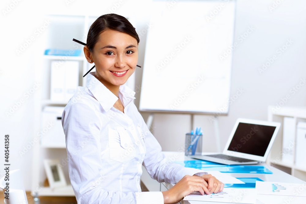 Young woman in business wear working in office Young woman in business wear working in office