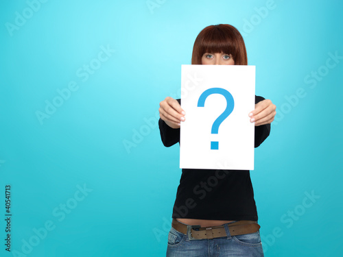 pretty young woman showing a question mark