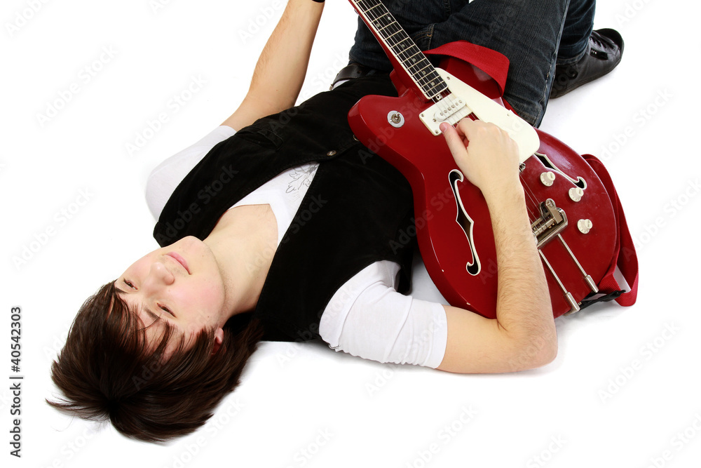A lying on the floor man with a guitar A lying on the floor man with a guitar