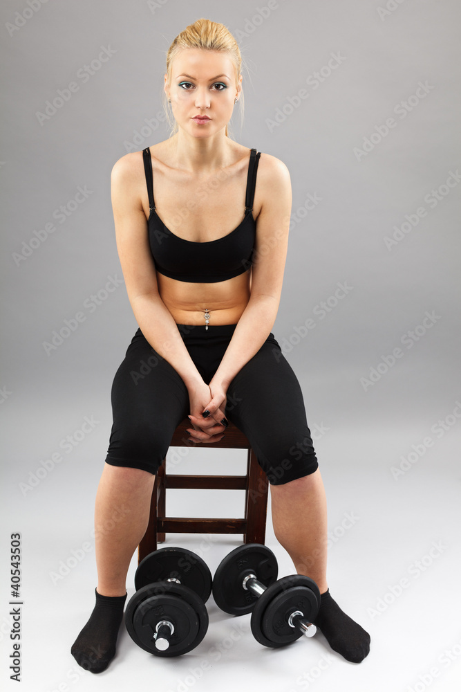 Athletic young lady working out with weights Athletic young lady working out with weights