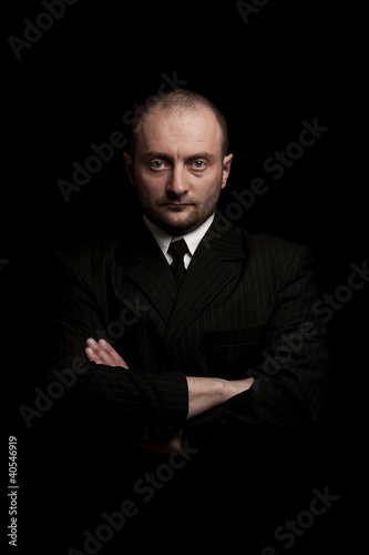 man in black suite