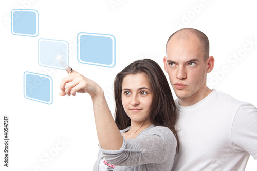 Young couple selecting on a virtual touch interface