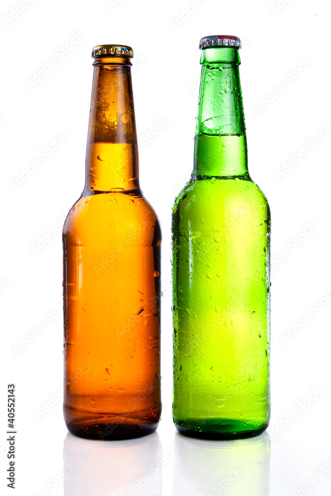 Green and brown beer bottle with drops drink without label on a Green and brown beer bottle with drops drink without label on a