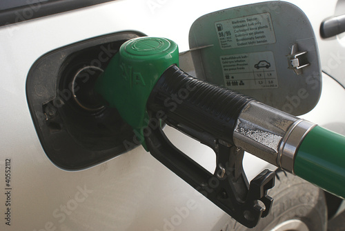 Refueling the car with expensive gasoline photo