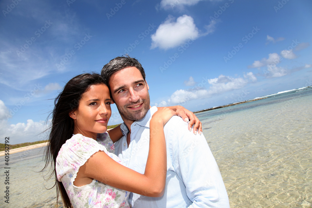 Couple of lovers embracing each other at the beach Couple of lovers embracing each other at the beach