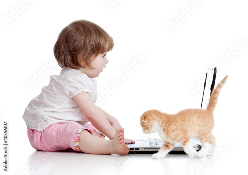 Funny child using a laptop ...