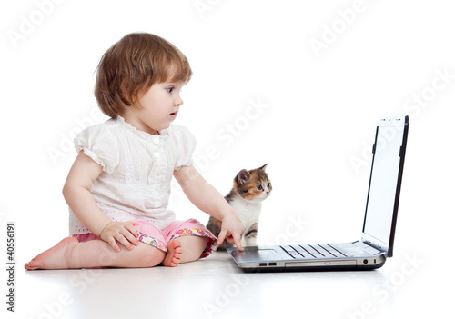 Funny child using a laptop ...