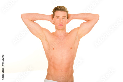 bare-chested man showing muscles