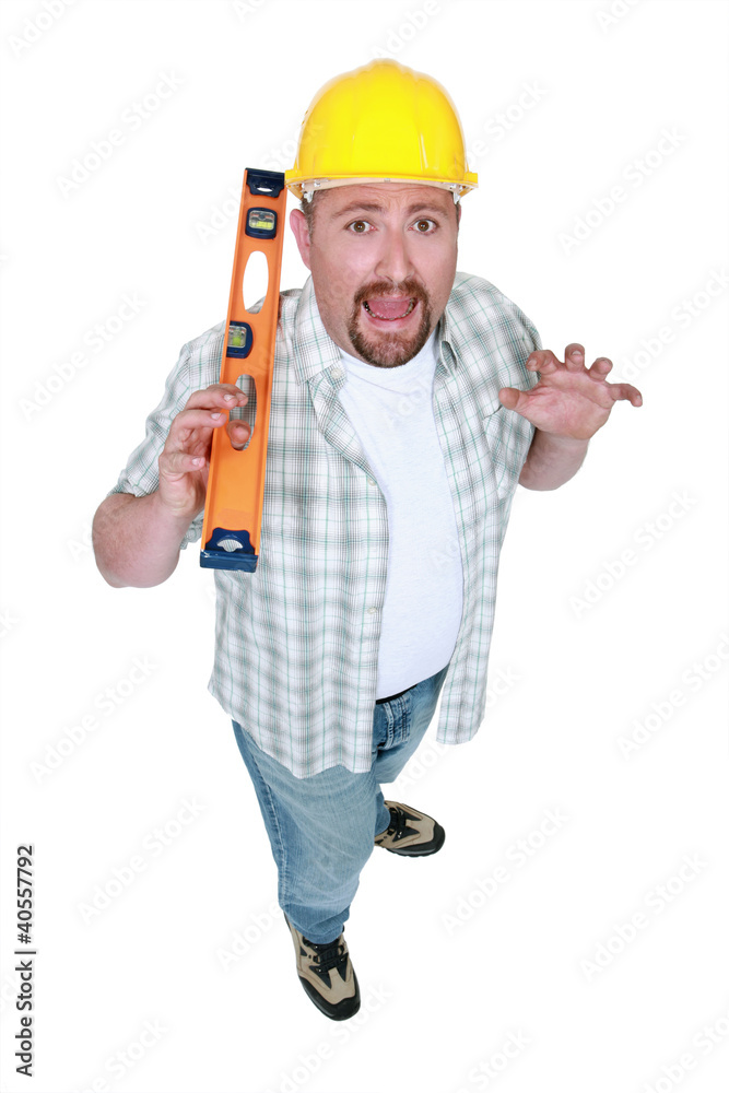 Scared builder with a spirit level Scared builder with a spirit level