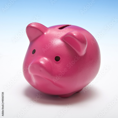 Pink piggy bank on a blue background.