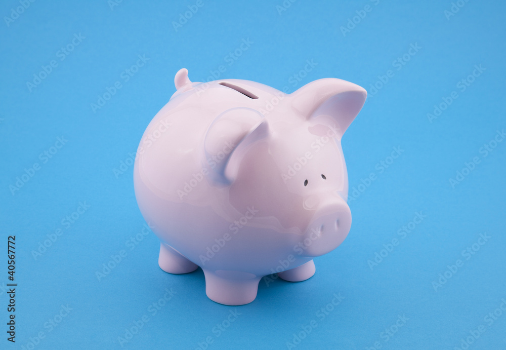 Piggy bank on blue background