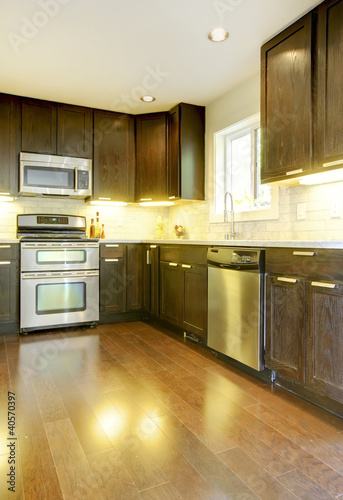 Modern luxury new dark brown and white kitchen.