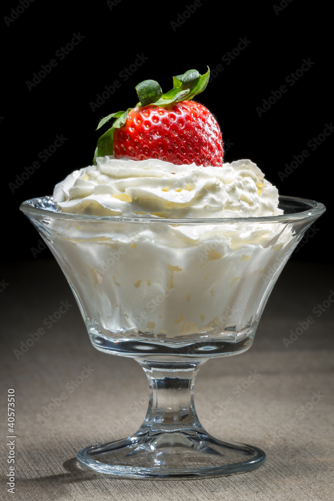Starwberry with whipped Cream in glass bowl Starwberry with whipped Cream in glass bowl