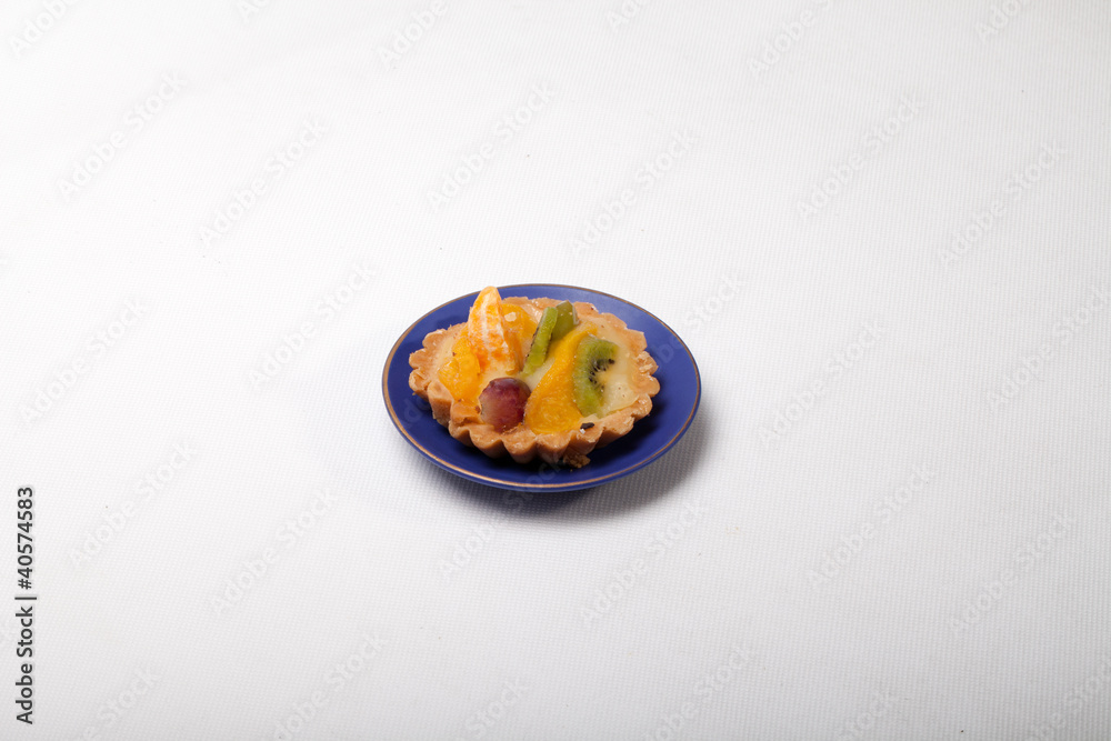 sweet cake with fruits isolated on white sweet cake with fruits isolated on white