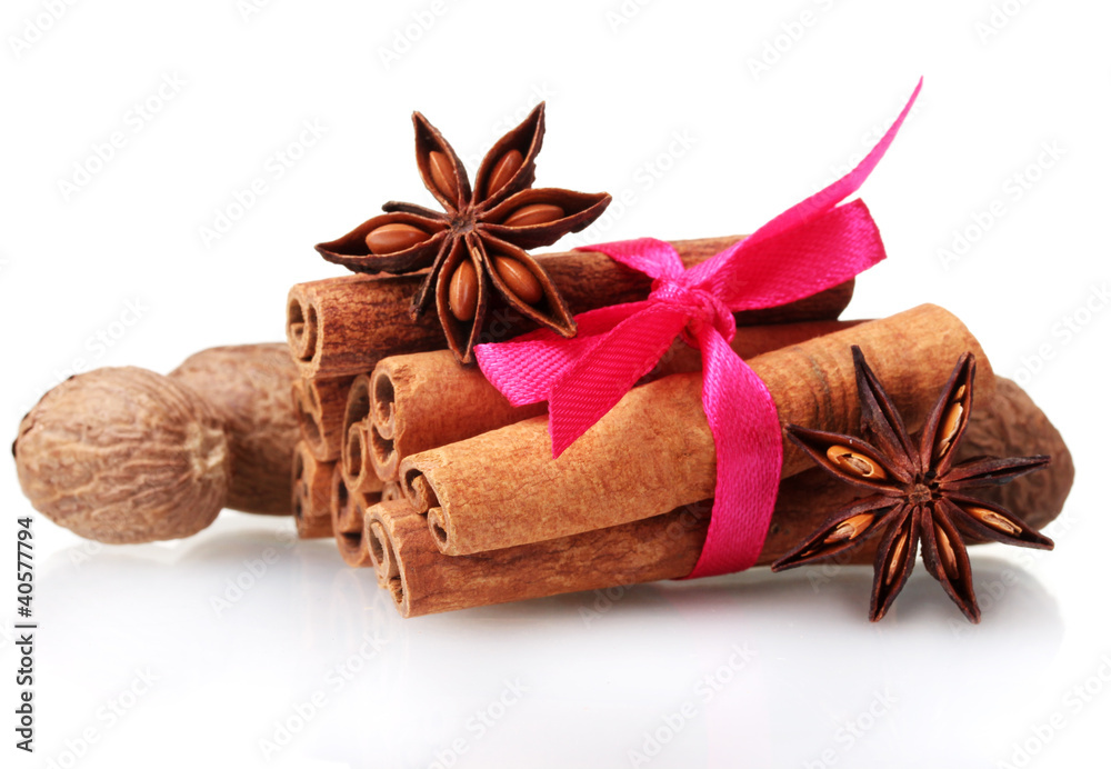 Cinnamon sticks, nutmeg and anise isolated on white Cinnamon sticks, nutmeg and anise isolated on white