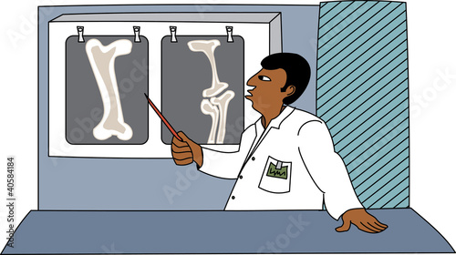 Black male doctor looking at x-rays