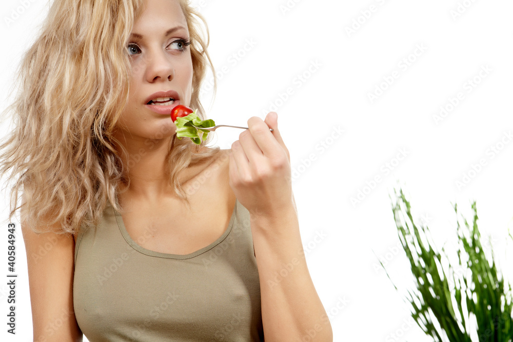 Portrait of young happy smiling woman eating salad Portrait of young happy smiling woman eating salad
