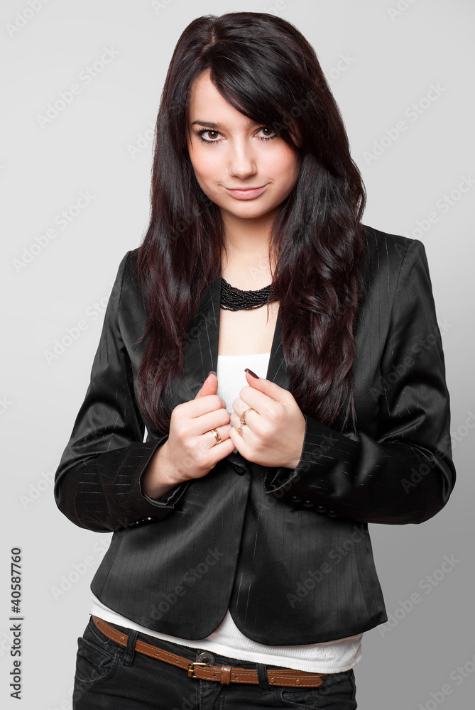 Beautiful model in black on grey background Beautiful model in black on grey background