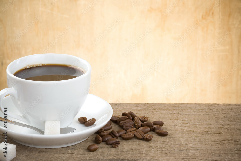 cup of coffee and beans on wood cup of coffee and beans on wood