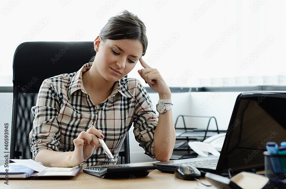 Young Beautiful Girl Thinking in the Office Young Beautiful Girl Thinking in the Office