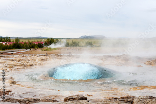 The Strokkur geyser about to erupt
