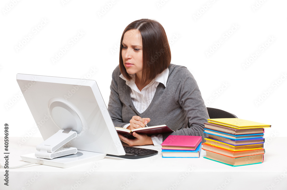 studio shot of young student with books and computer studio shot of young student with books and computer