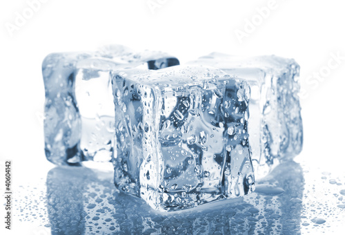 Three ice cubes with water drops