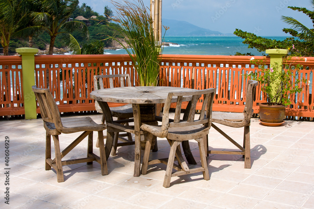 Table and chairs with a beautiful sea view . Thailand . Table and chairs with a beautiful sea view . Thailand .