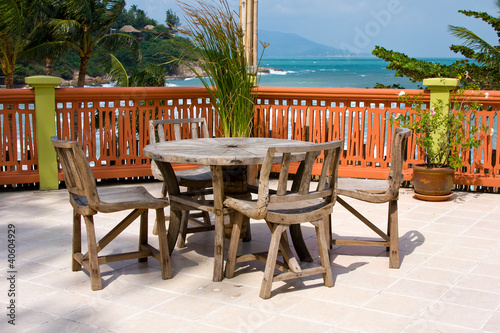 Table and chairs with a beautiful sea view . Thailand .