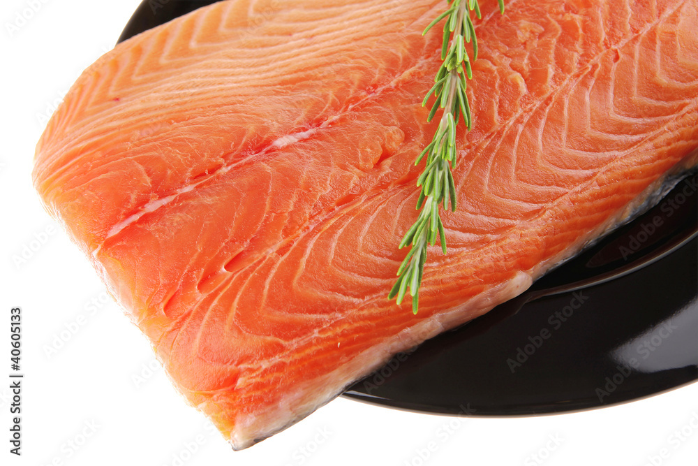 fresh raw salmon fillet on black with rosemary fresh raw salmon fillet on black with rosemary