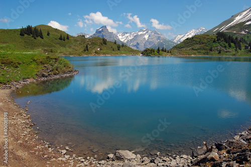 Crystal clear water of alpine lake in Swiss Alps