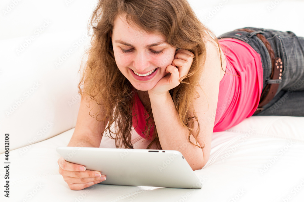woman on the couch with her tablet woman on the couch with her tablet