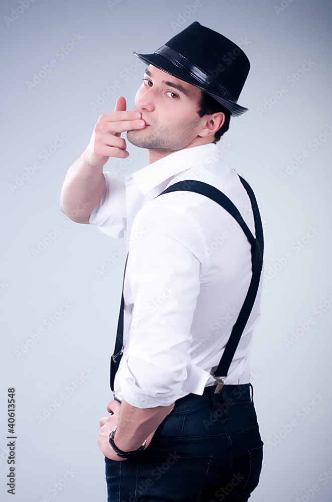 Valentines romantic man in hat and suspenders Valentines romantic man in hat and suspenders
