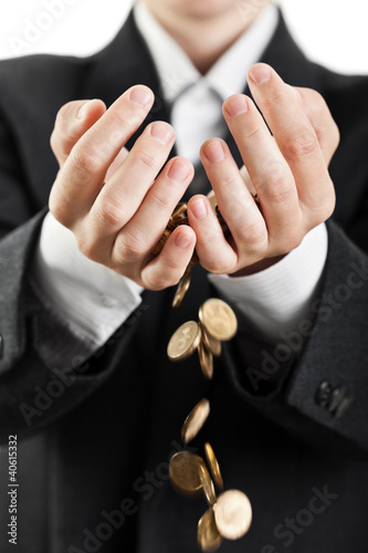 Spilling coins in hands