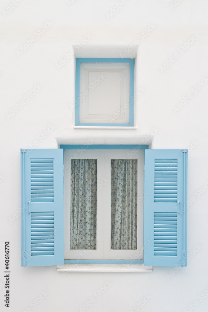 Blue window on white house